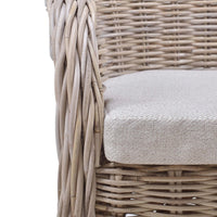 Close-up of chair cushion on natural rattan dining chair.