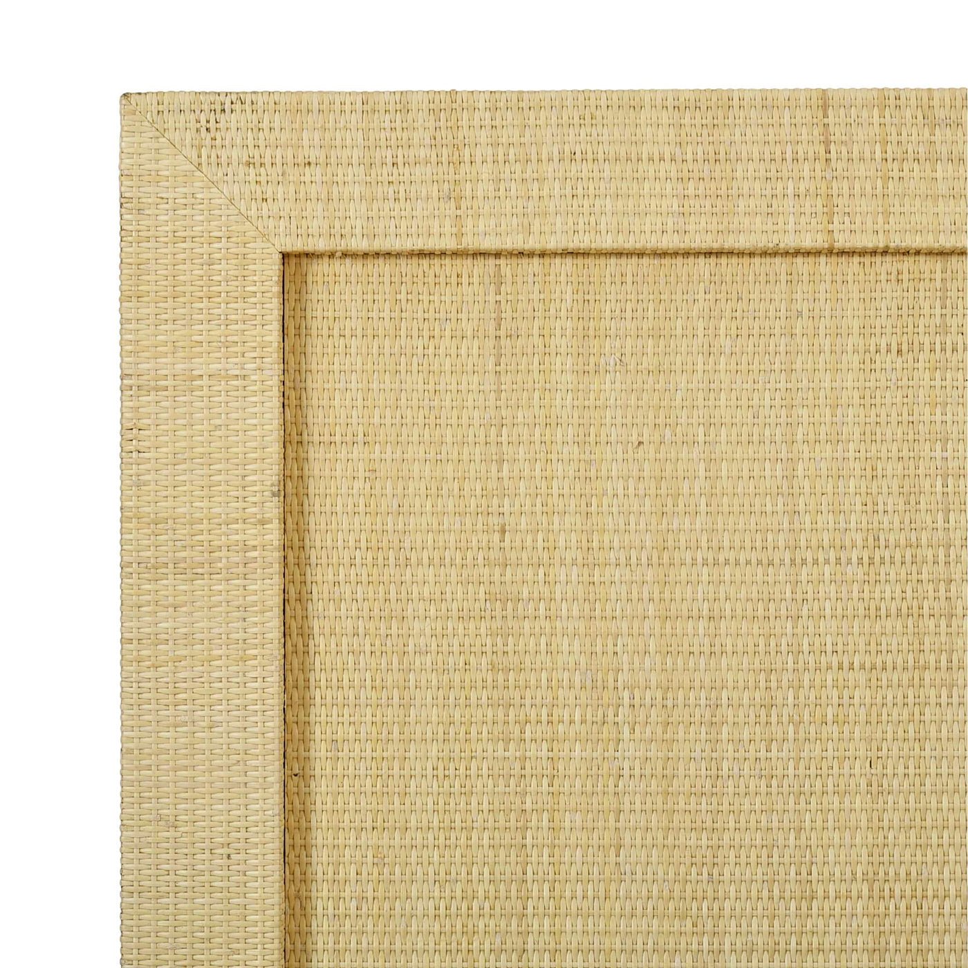 Close-up of rattan texture on king bed frame.