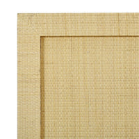 Close-up of rattan texture on king bed frame.