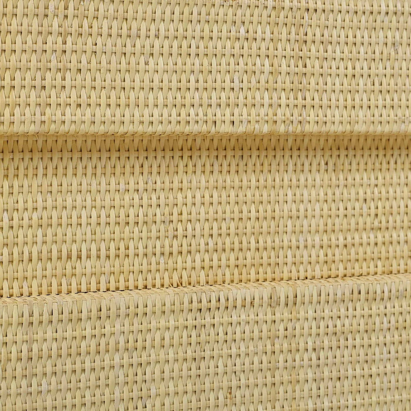 Detailed rattan weave on king bed frame.
