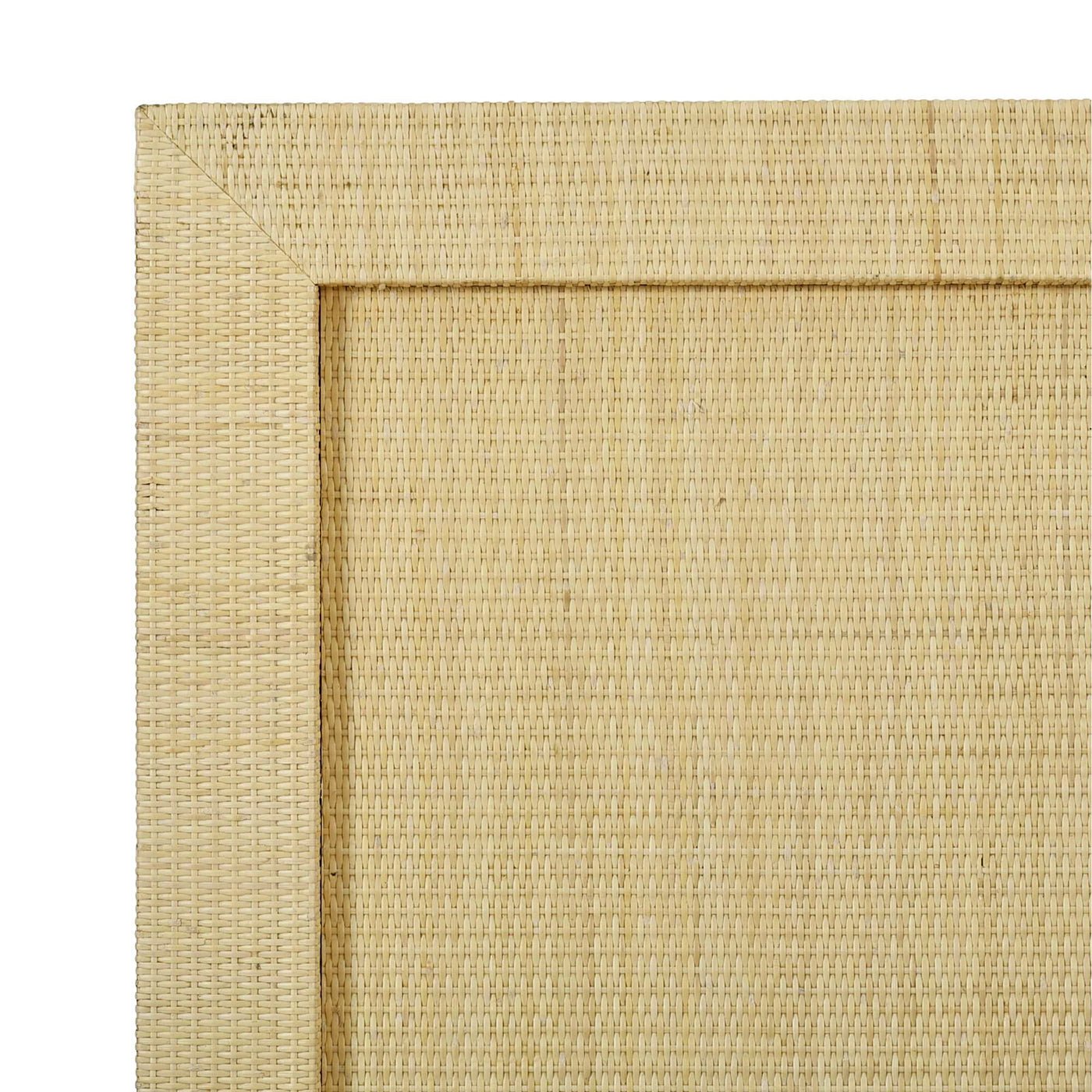Close-up of rattan texture on bed frame.