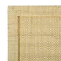 Close-up of rattan texture on bed frame.