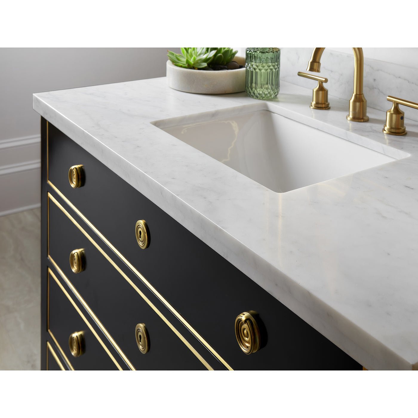 Close-up of countertop and faucet on black vanity.
