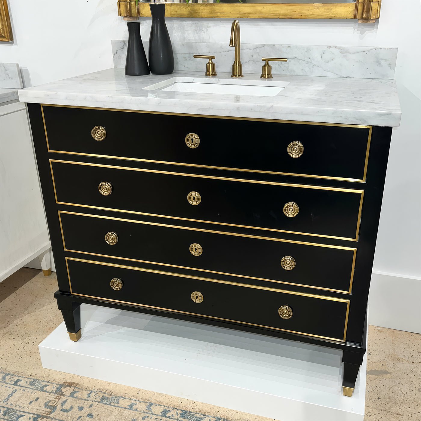 Black vanity with marble top in showroom display.