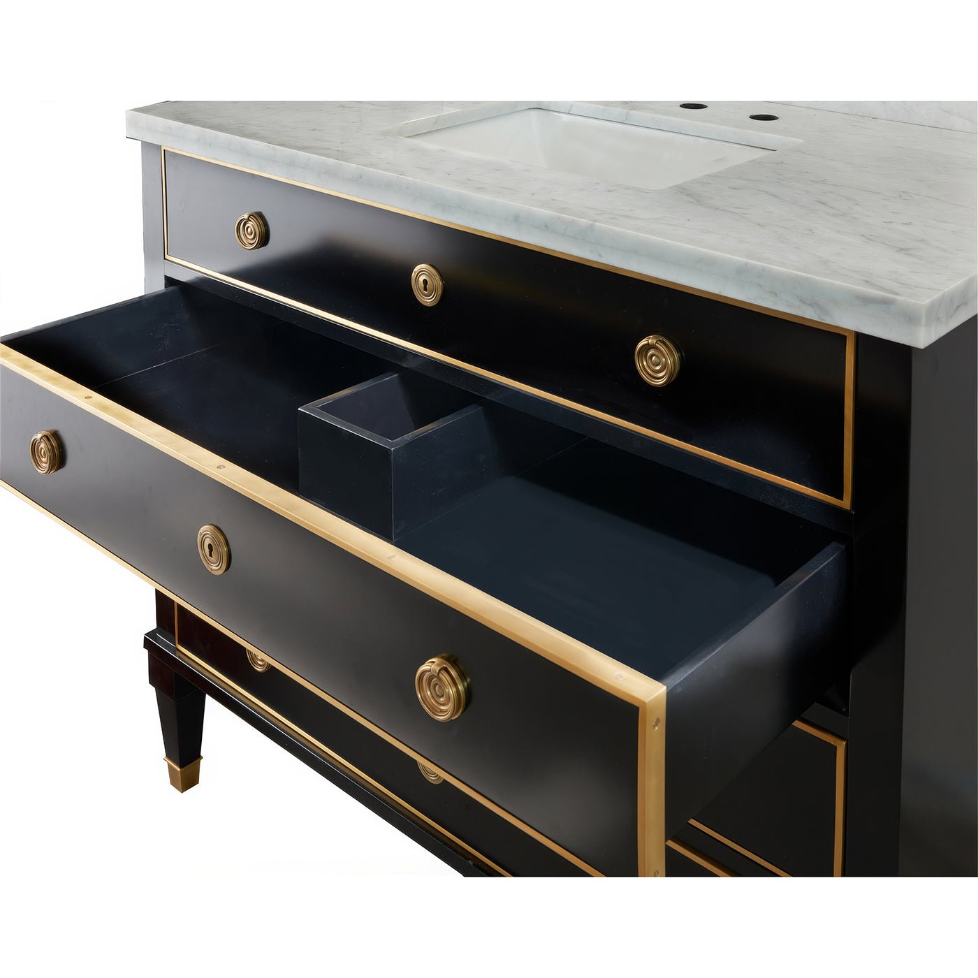 Open drawer of black vanity showcasing storage space.