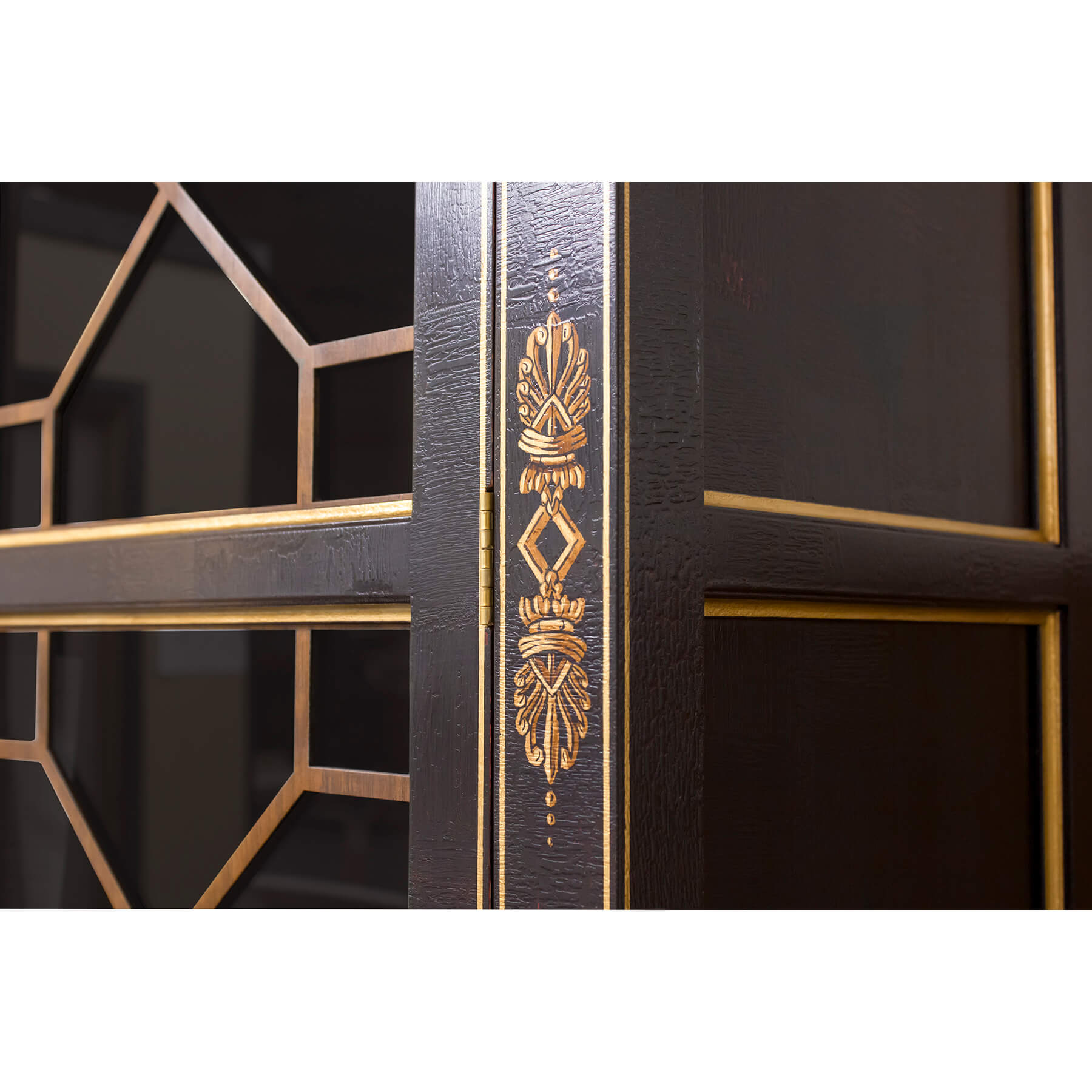 Detailed close-up of Neo Classic bookcase ornate pattern.