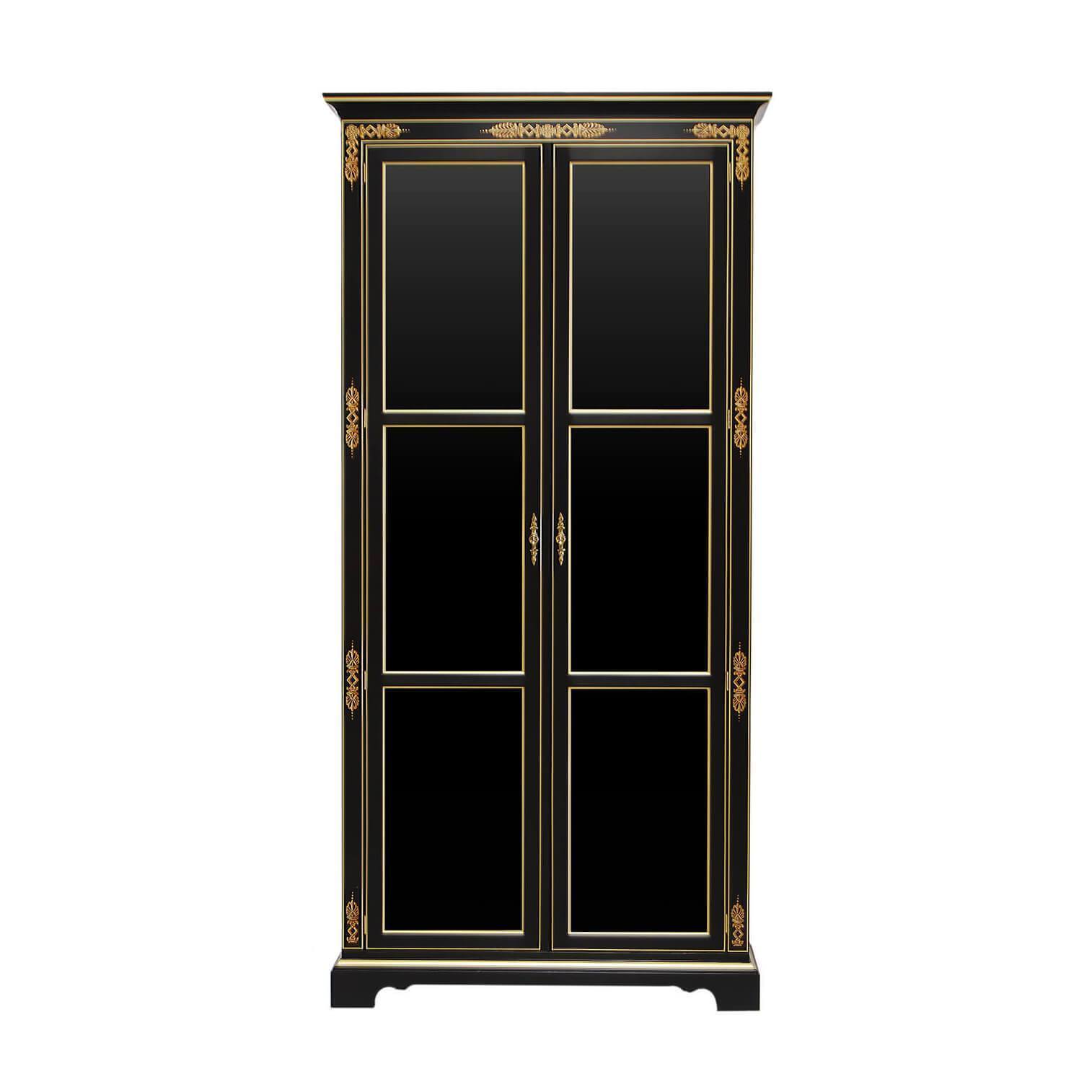 Elegant black cabinet with gold accents, front view.