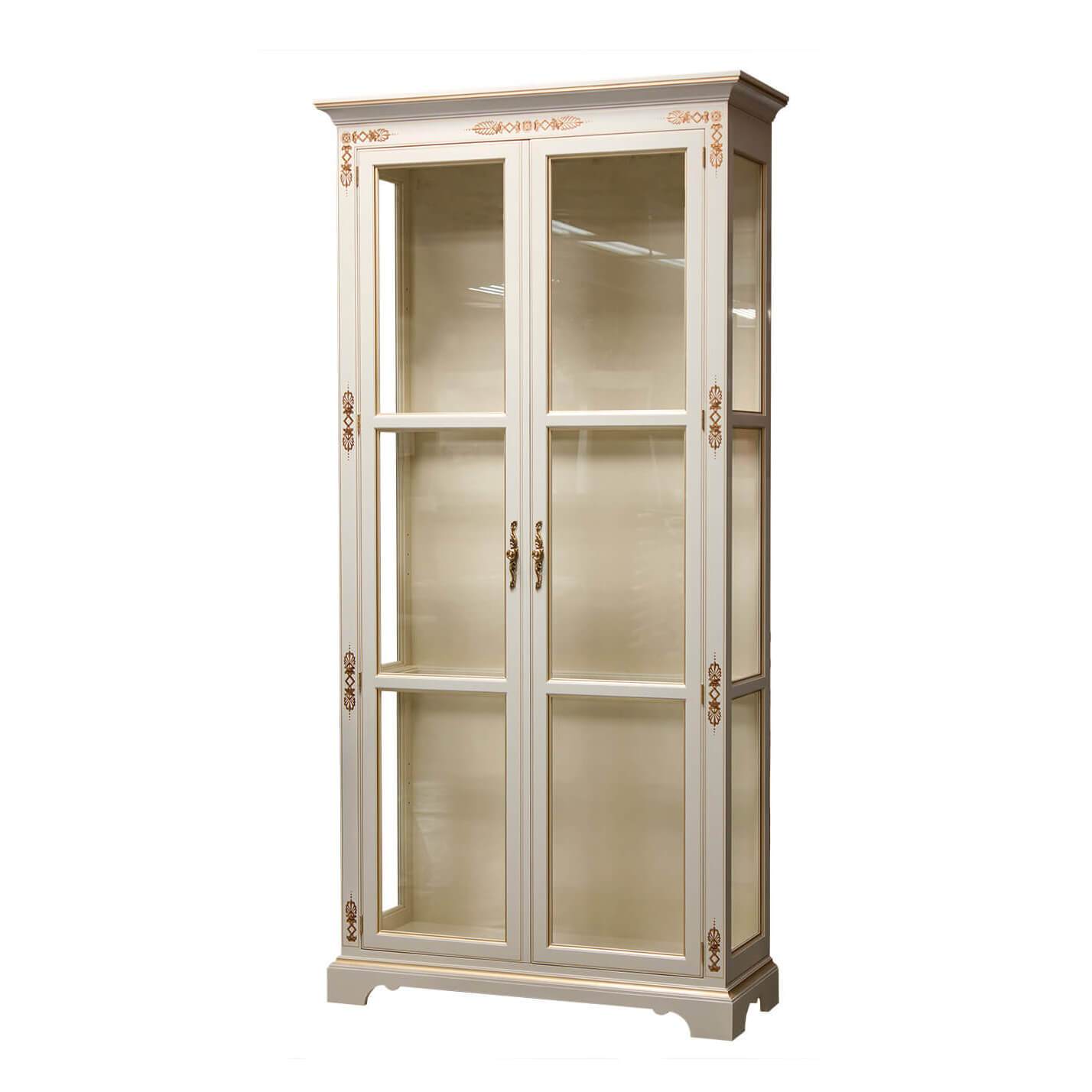 White curio cabinet with glass doors and decorative details.