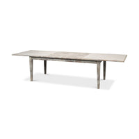 Fully extended gray painted extension dining table side view.