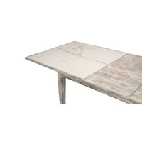 Close-up of gray painted dining table corner detail.