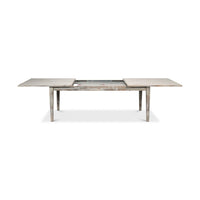 Half-extended gray painted dining table with visible mechanism.