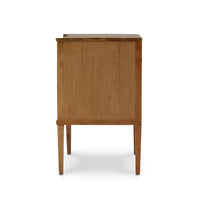Side view of slender-legged nightstand in natural wood.