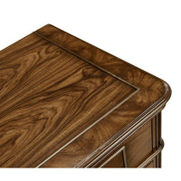 Close-up, top surface of neo classic bedside chest.
