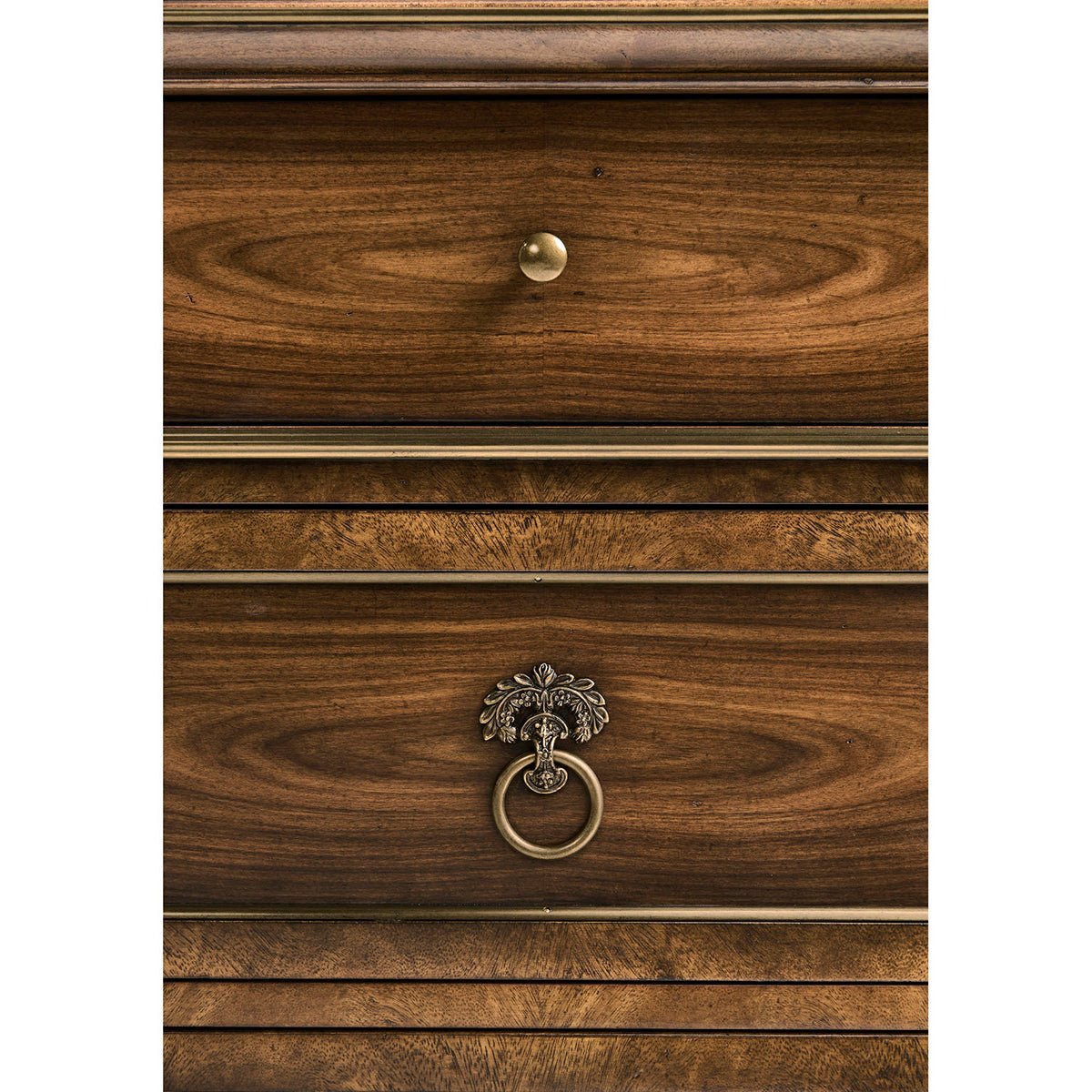 Neo classic bedside chest drawer handles, close-up.