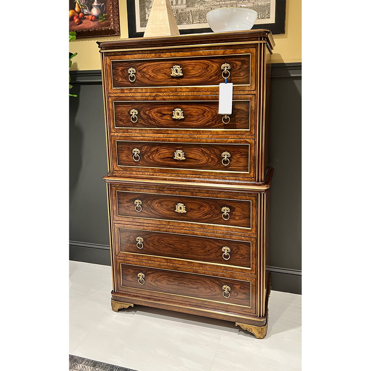 Neo classic chest displayed in decorated interior setting.