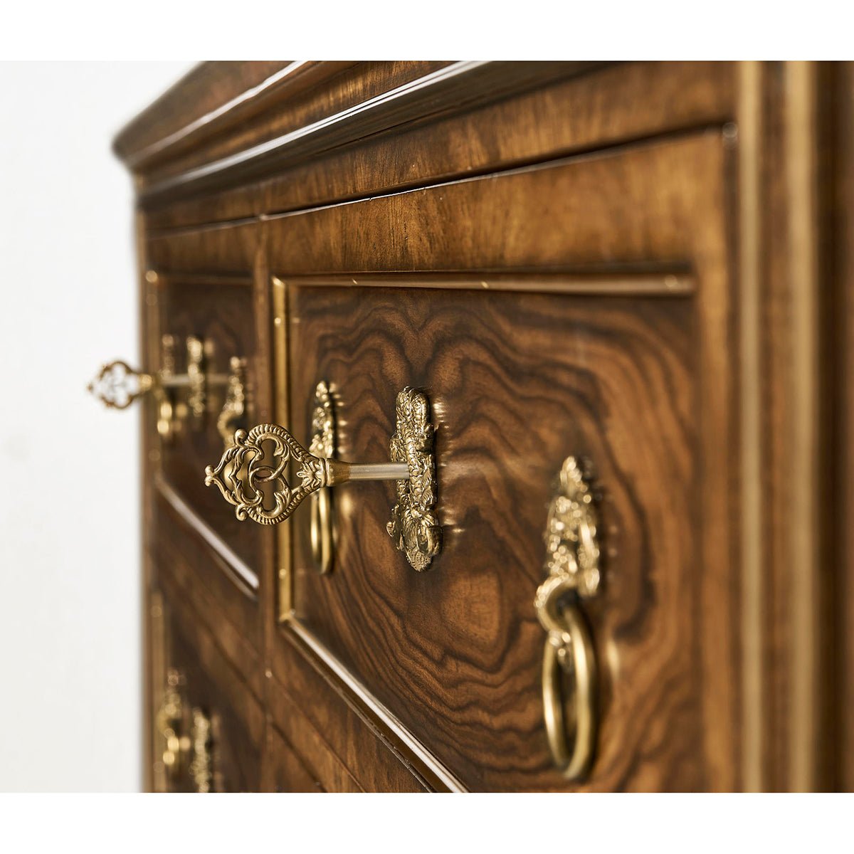 Close-up of Neo Classic inspired dresser's ornate drawer handles.