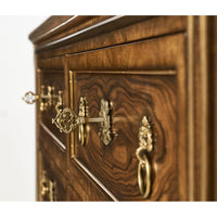 Close-up of Neo Classic inspired dresser's ornate drawer handles.