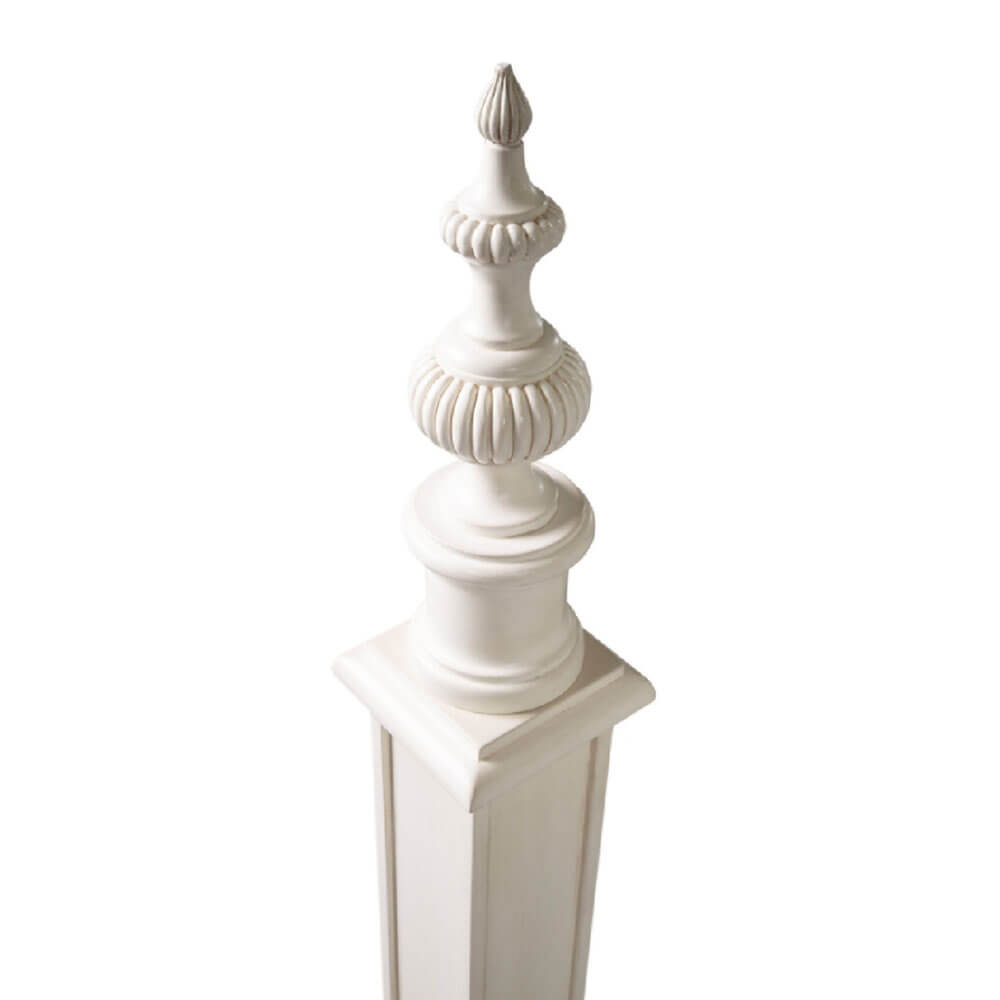 Decorative post finial on classic king bed.