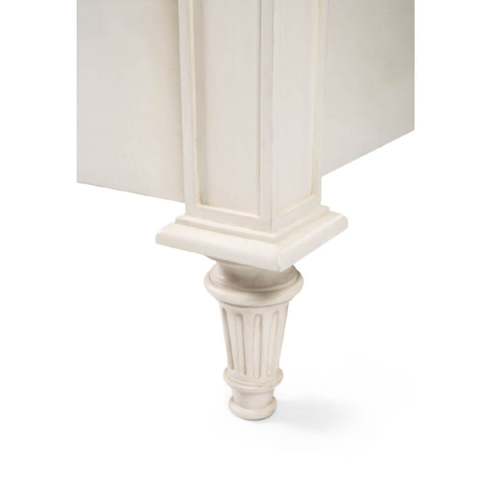 Lower bed frame corner detail in white finish.