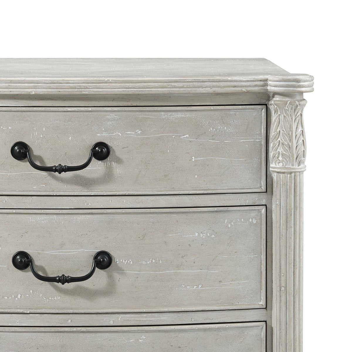 Detailed view of nightstand top corner, black handles visible.