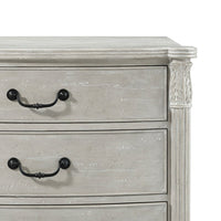 Detailed view of nightstand top corner, black handles visible.