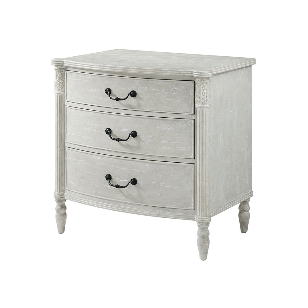 Gray nightstand with three drawers, angled front view.