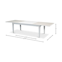 Dimensions overlay on extended white dining table.