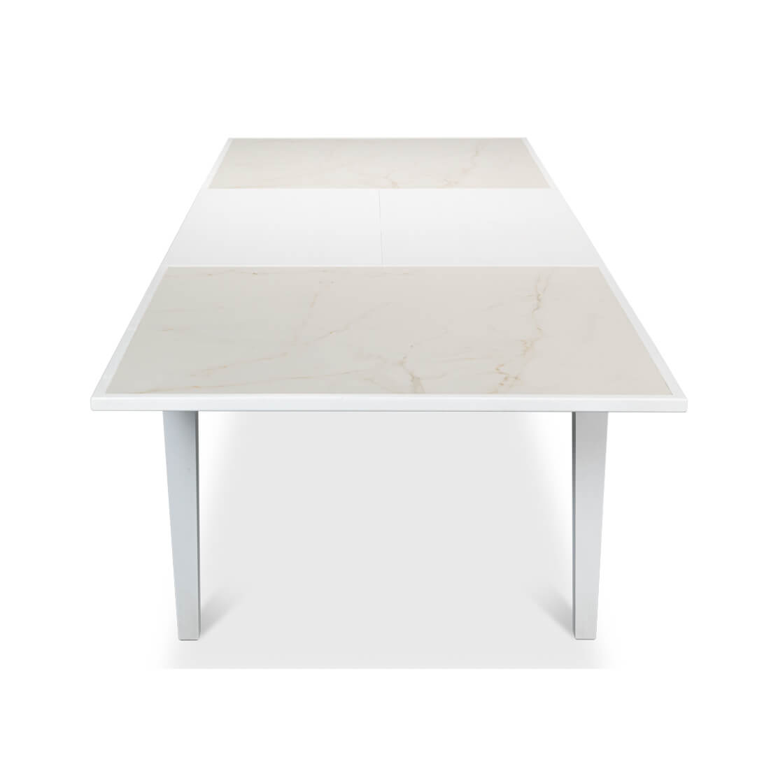 Close-up top view, white table surface, extension visible.