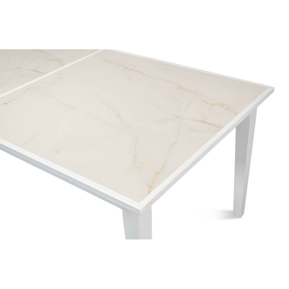 Detailed close-up, white and marble table surface.