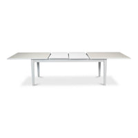 White dining table, partially extended with section visible.