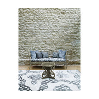 Styled Gustavian bench with pillows in living room.