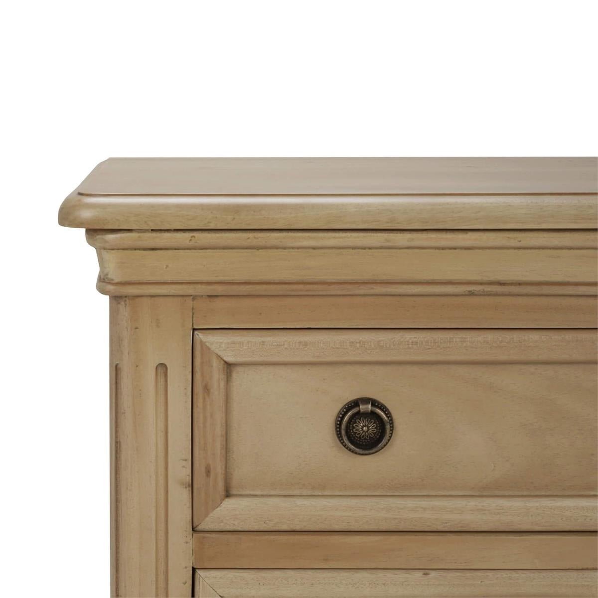 Close-up of neoclassical nightstand top corner detail.