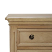 Close-up of neoclassical nightstand top corner detail.