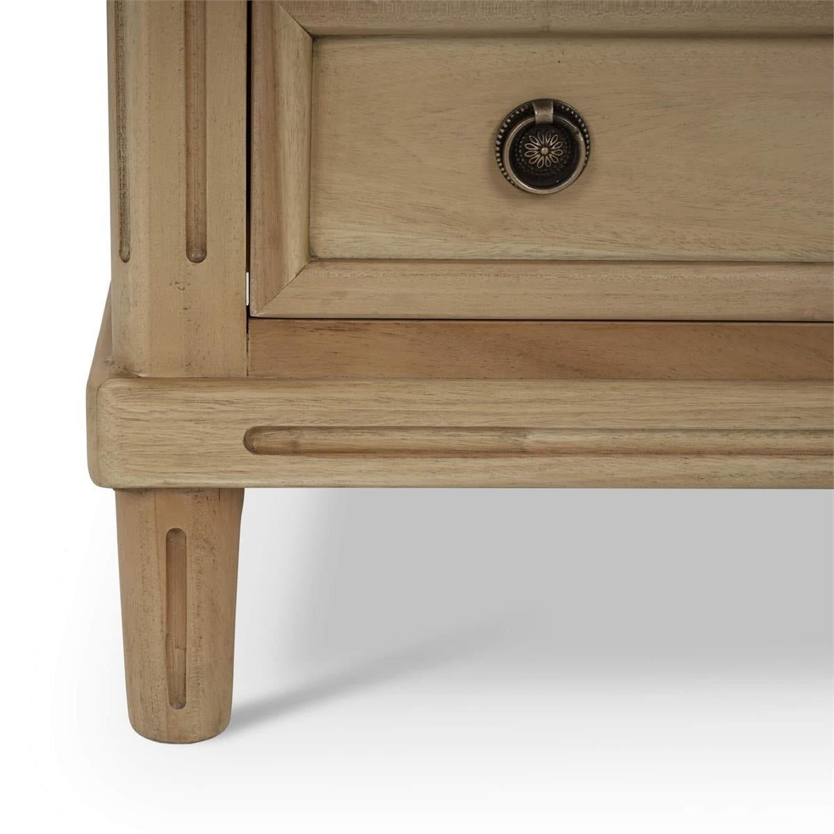 Bottom corner detail of neoclassical nightstand leg.