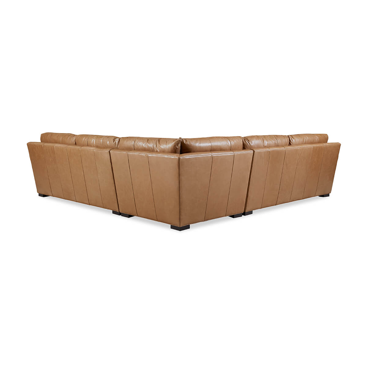 Back view of tan leather sectional sofa.