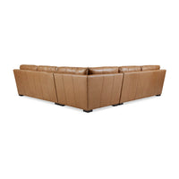 Back view of tan leather sectional sofa.