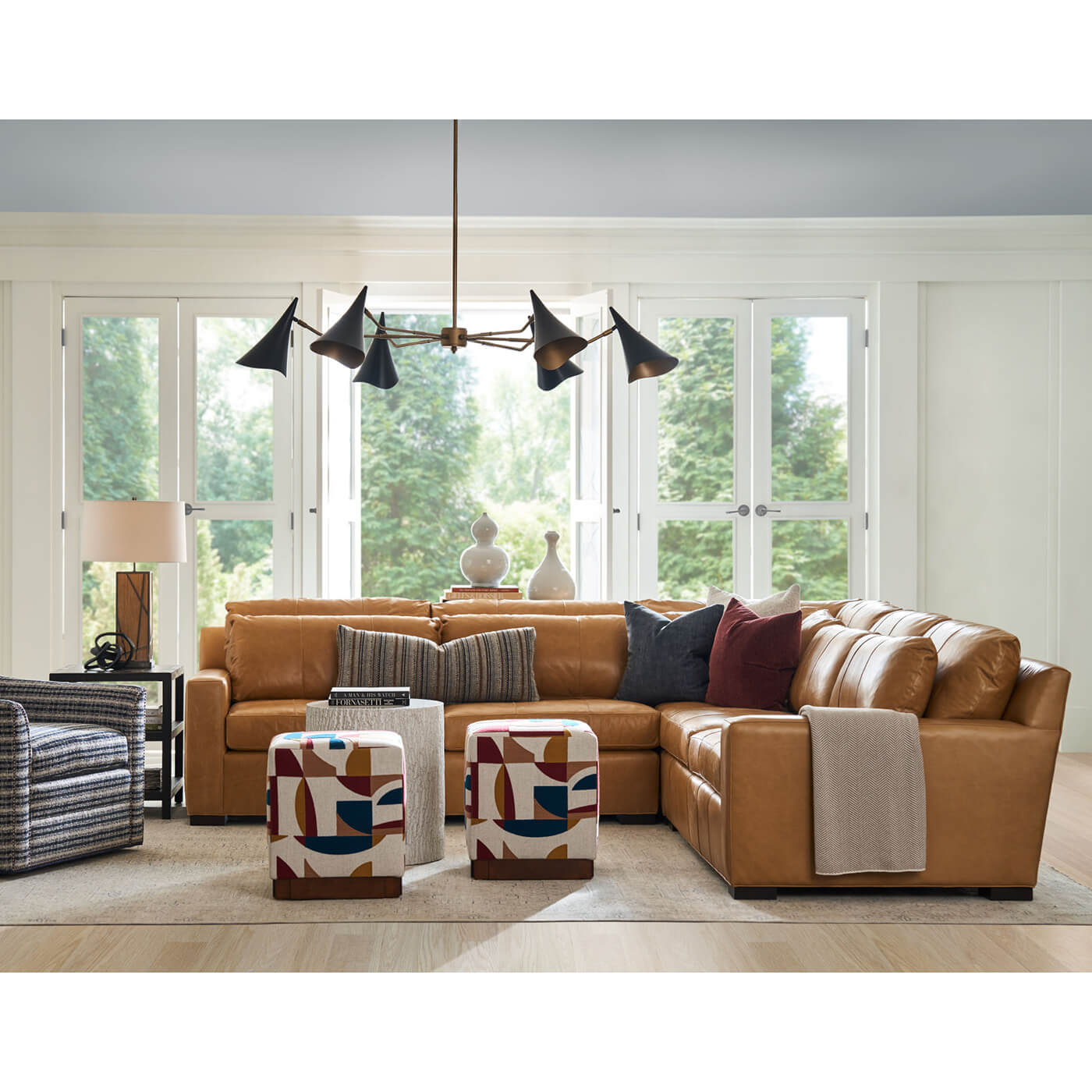 Tan leather sectional sofa in stylish living room.