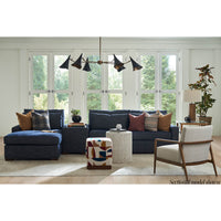 Blue sectional sofa in bright living room scene.