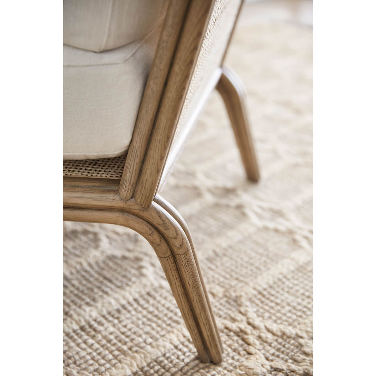 Newport Coastal Armchair, detailed close-up of leg design.