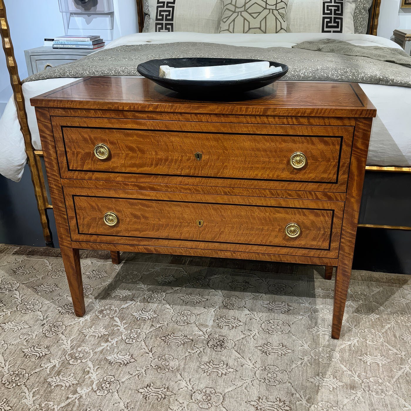 Commode chest styled in bedroom setting.