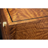 Wood grain detail on commode chest top.