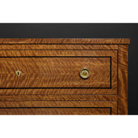 Close-up of drawer handle on commode chest.