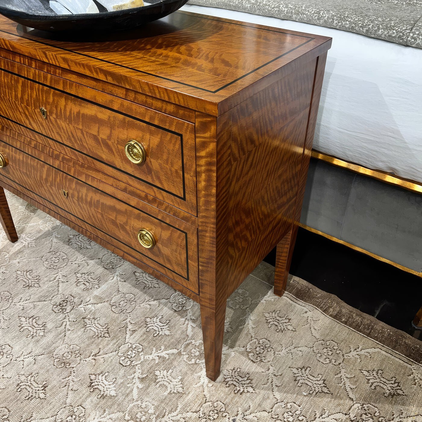 Side view of Northern European style commode chest.