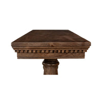 Detailed edge of classic console table, intricate trim.
