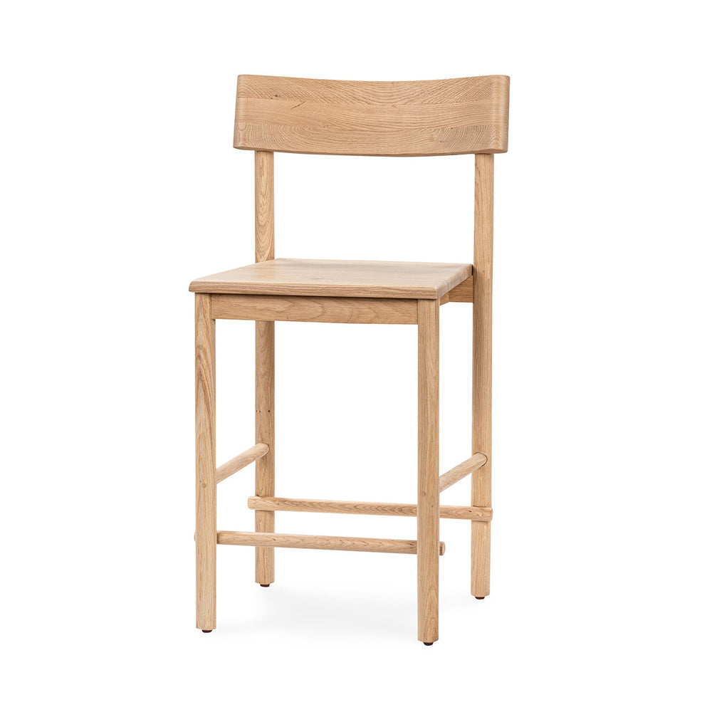 Three-quarter front view of a light oak counter stool with an open back and wood footrest