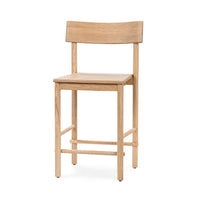 Three-quarter front view of a light oak counter stool with an open back and wood footrest
