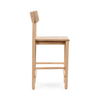 Side view of the oak counter stool showing its gently angled backrest and solid wood seat