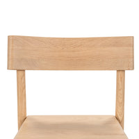 Close-up of the curved oak backrest and open back above the wood seat