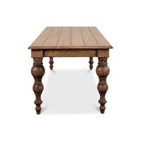 End view of oak farmhouse dining table.