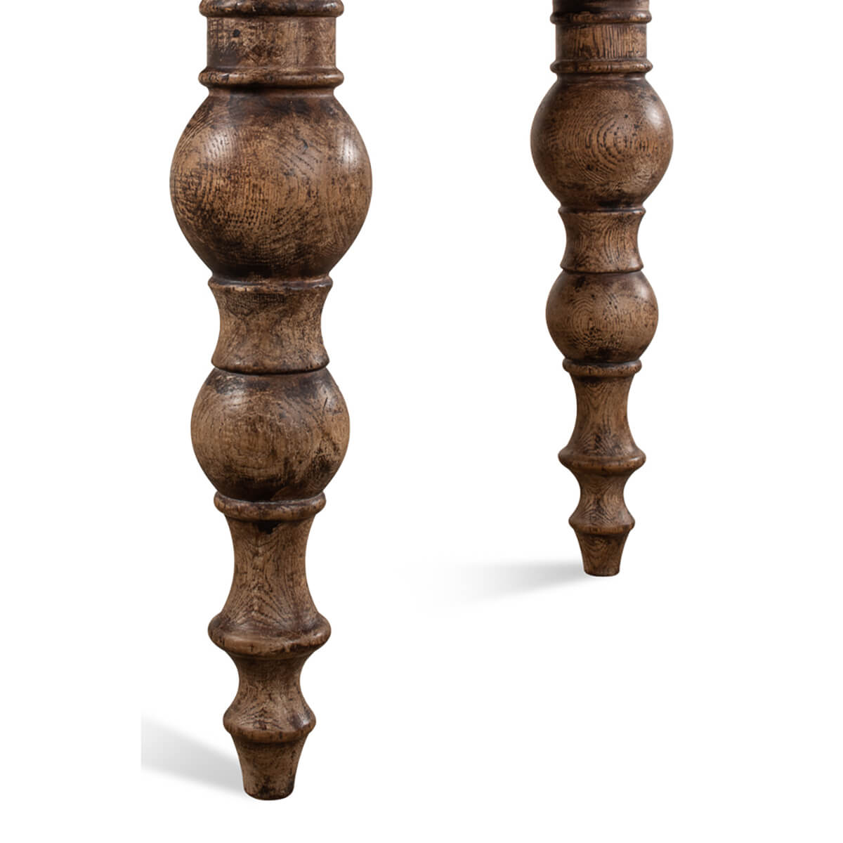 Close-up detail of oak table leg design.